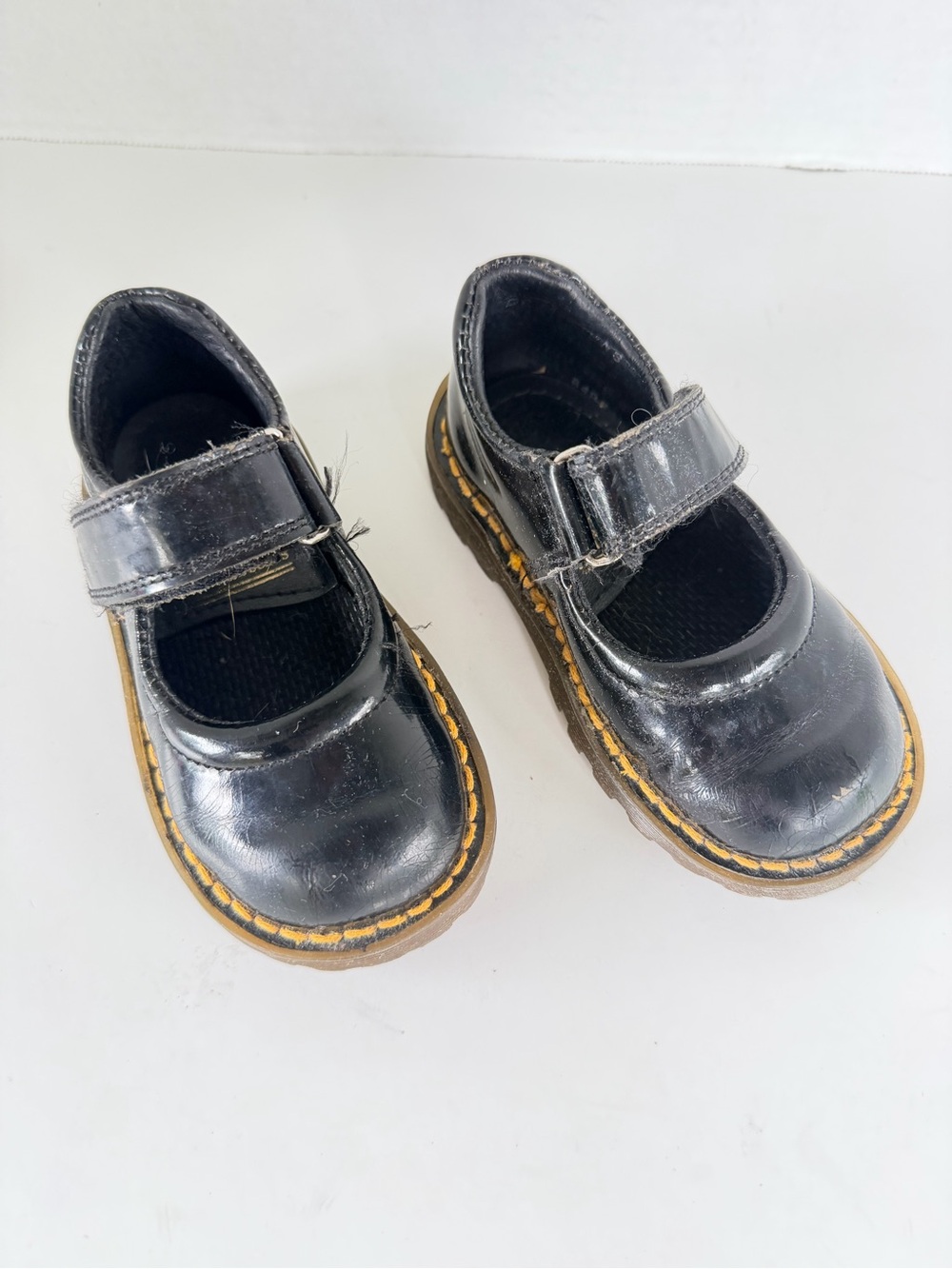 Dr. Martens Kids Black Mary Jane Shoes with Yellow Stitching